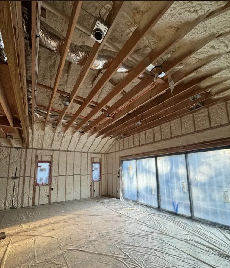 Interior walls and ceiling insulated with spray foam during new construction in Gulf Shores